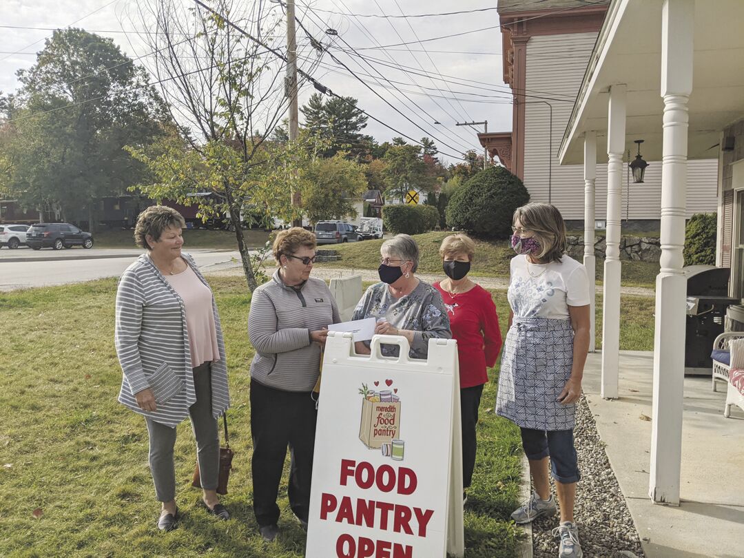 Ladies golf league donates to Meredith Food Pantry